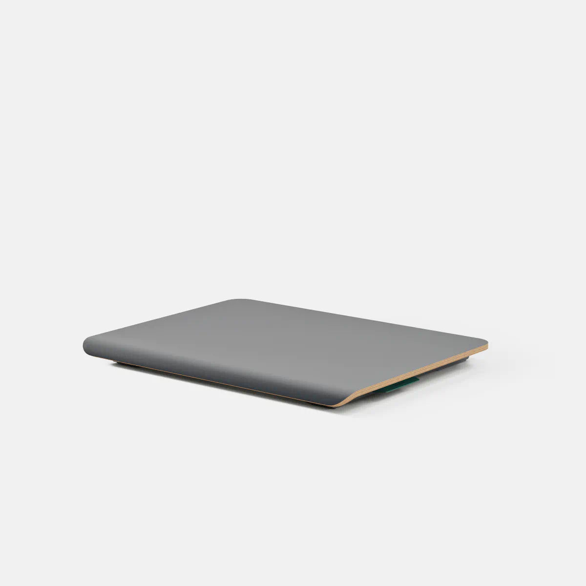Branch Desk Riser in the Carbon finish, shown collapsed without the optional shelf