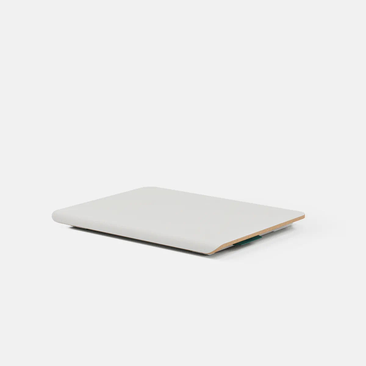 Branch Desk Riser in the White finish, shown collapsed without the optional shelf