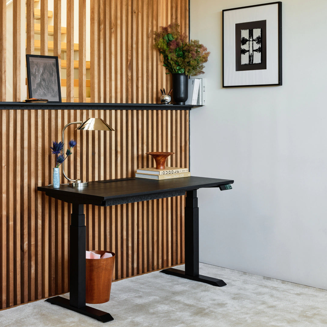Branch Tria standing desk with Black Oak laminated-MDF top and Black legs; media does not identify selected size.