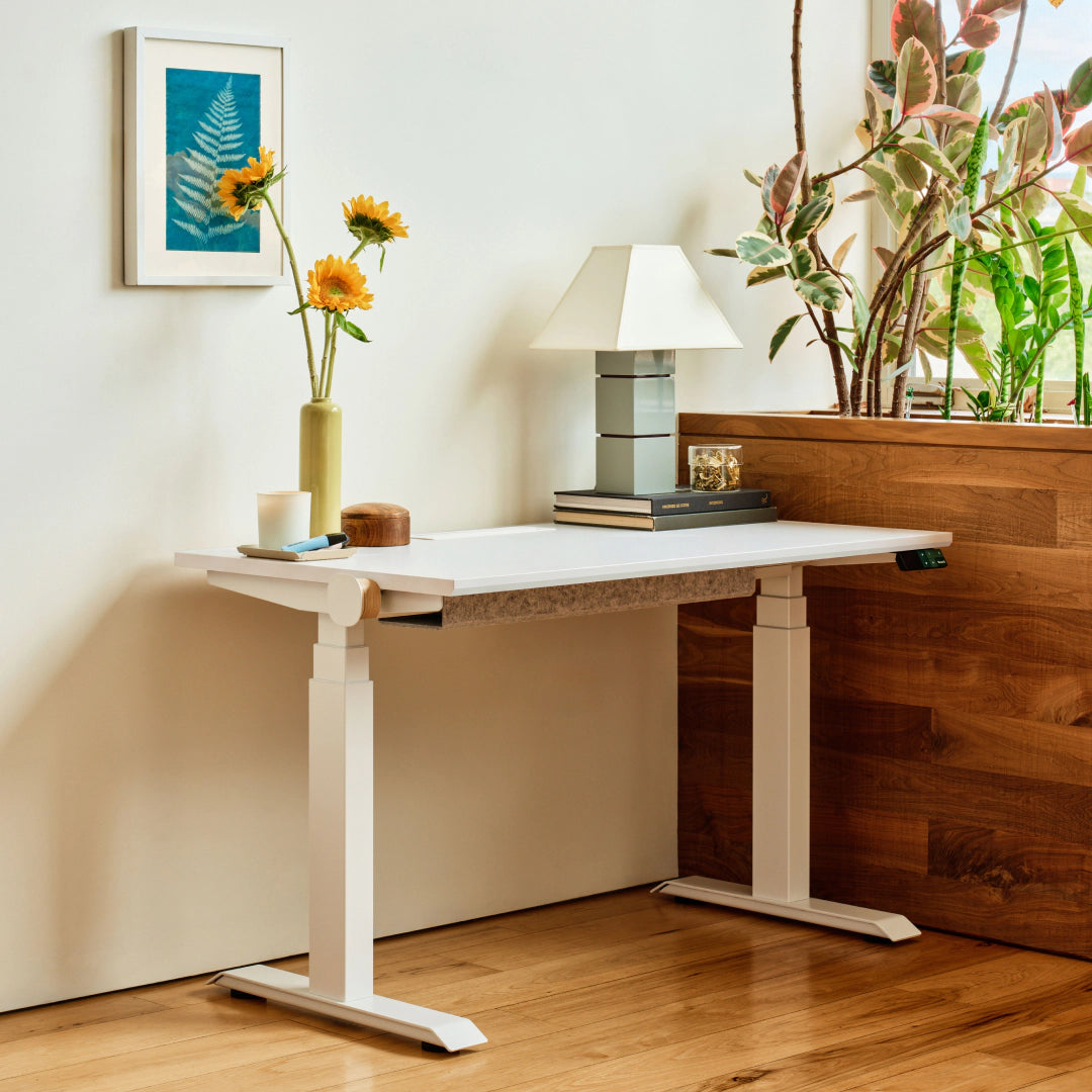 Branch Tria standing desk with White laminated top and White legs; the shared manufacturer image does not identify size or optional accessories