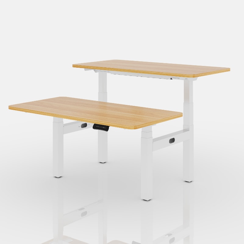FlexiSpot E7H two-position standing-desk frame shown with two separate work surfaces
