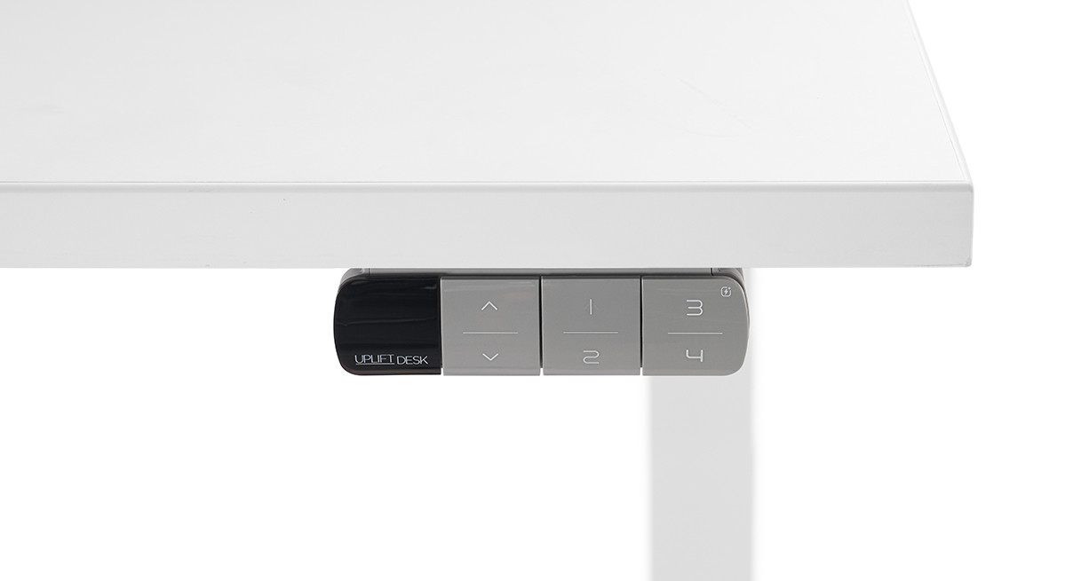 Gray UPLIFT FRM715 keypad under a light desktop; keypad finish option only