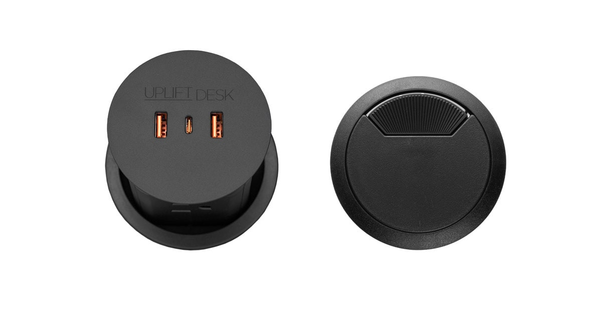 Black PDC013 Pop Up Power Grommet shown lowered with its separate black pass-through cover; component option only, not the assembled desk