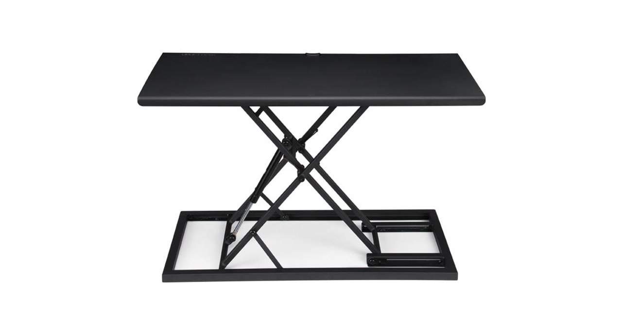 UPLIFT E3 Compact Standing Desk Converter model UDA121 in black, raised on its base without a host desk