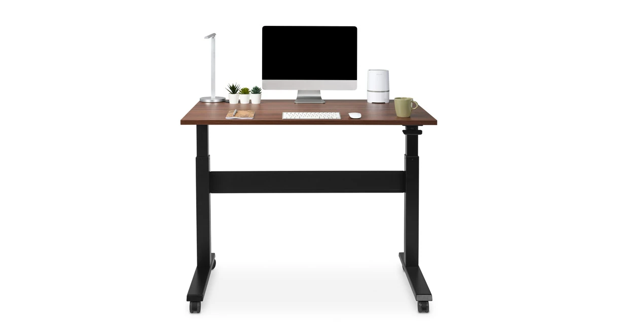UPLIFT Pneumatic Standing Desk rendering with a 48 × 30 inch Walnut Laminate top, black FRM240 frame and standard black casters