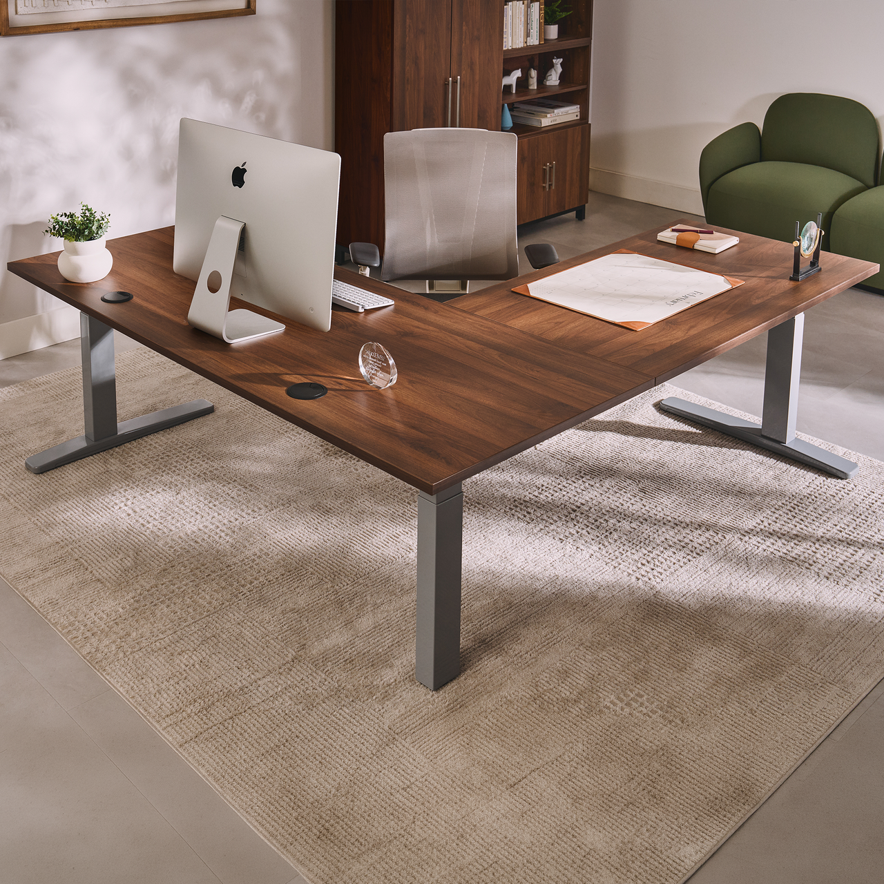 UPLIFT V3 three-leg L-shaped desk frame beneath two joined desktop wings